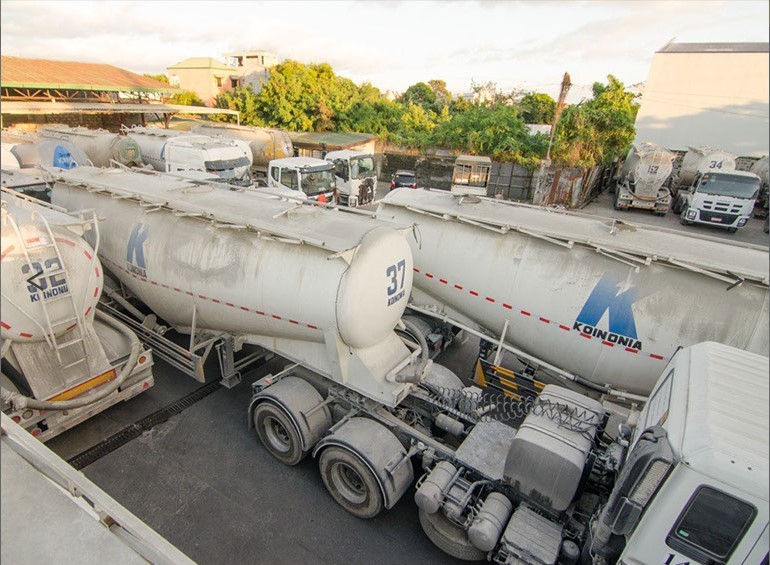Cement delivery fleet at a Koinonia logistics facility